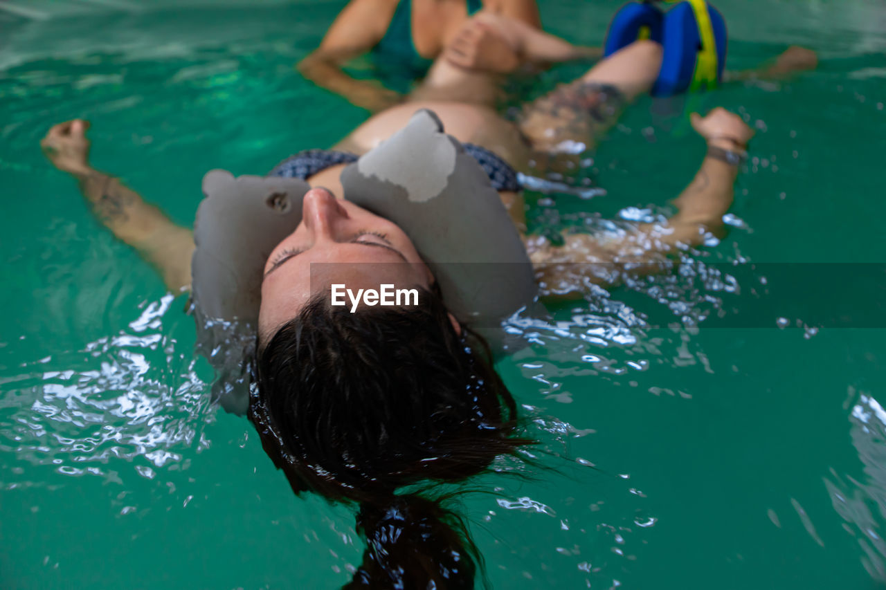 High angle view of people swimming in pool