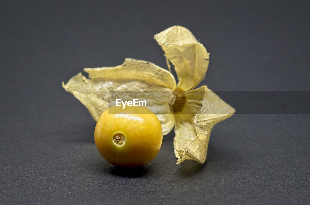 CLOSE-UP OF FRUITS ON TABLE