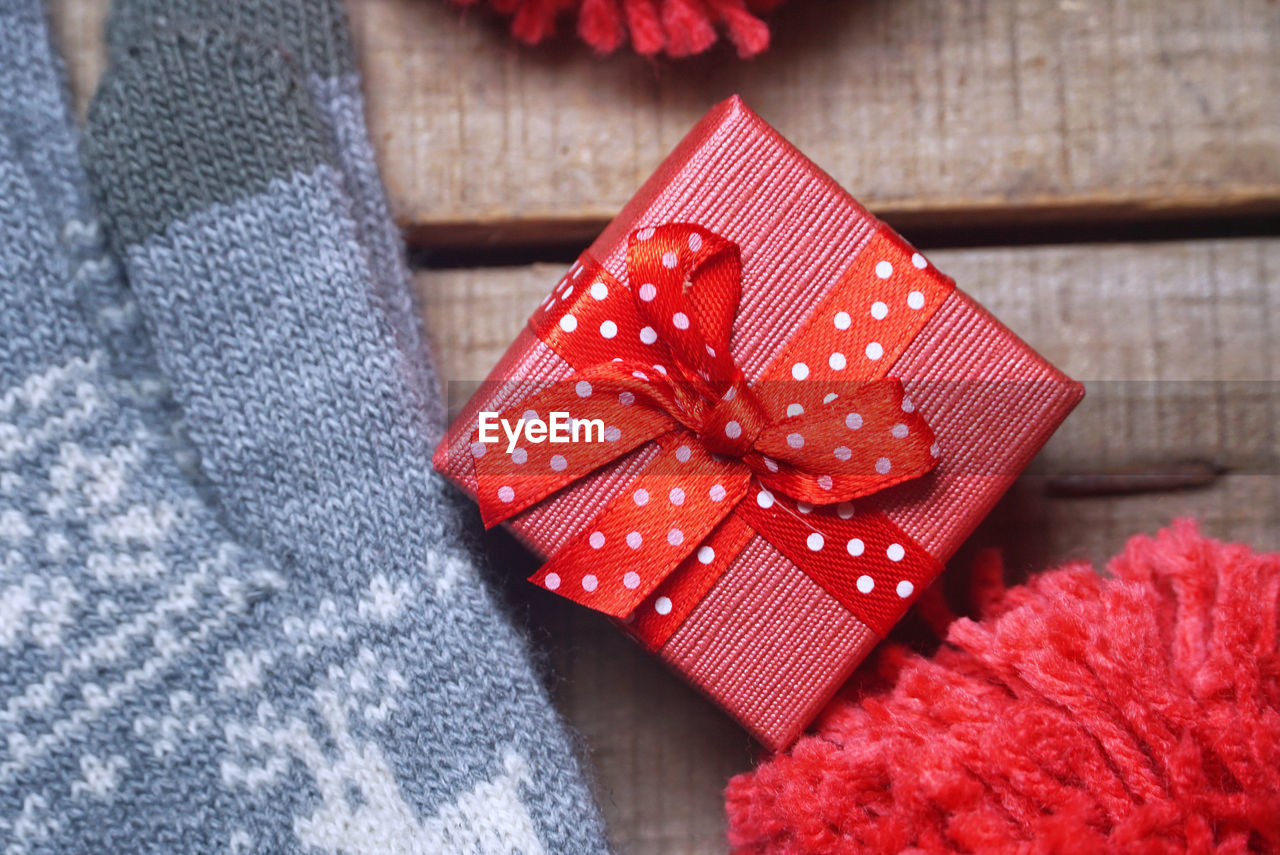 Close-up of red gift on table