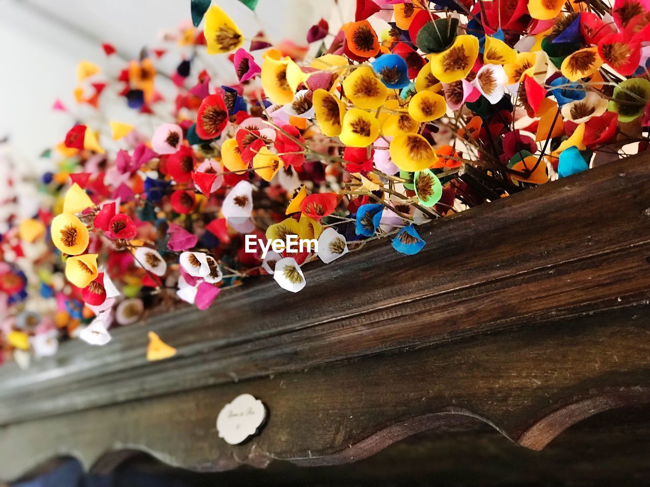 Close-up of colorful artificial flowers on table