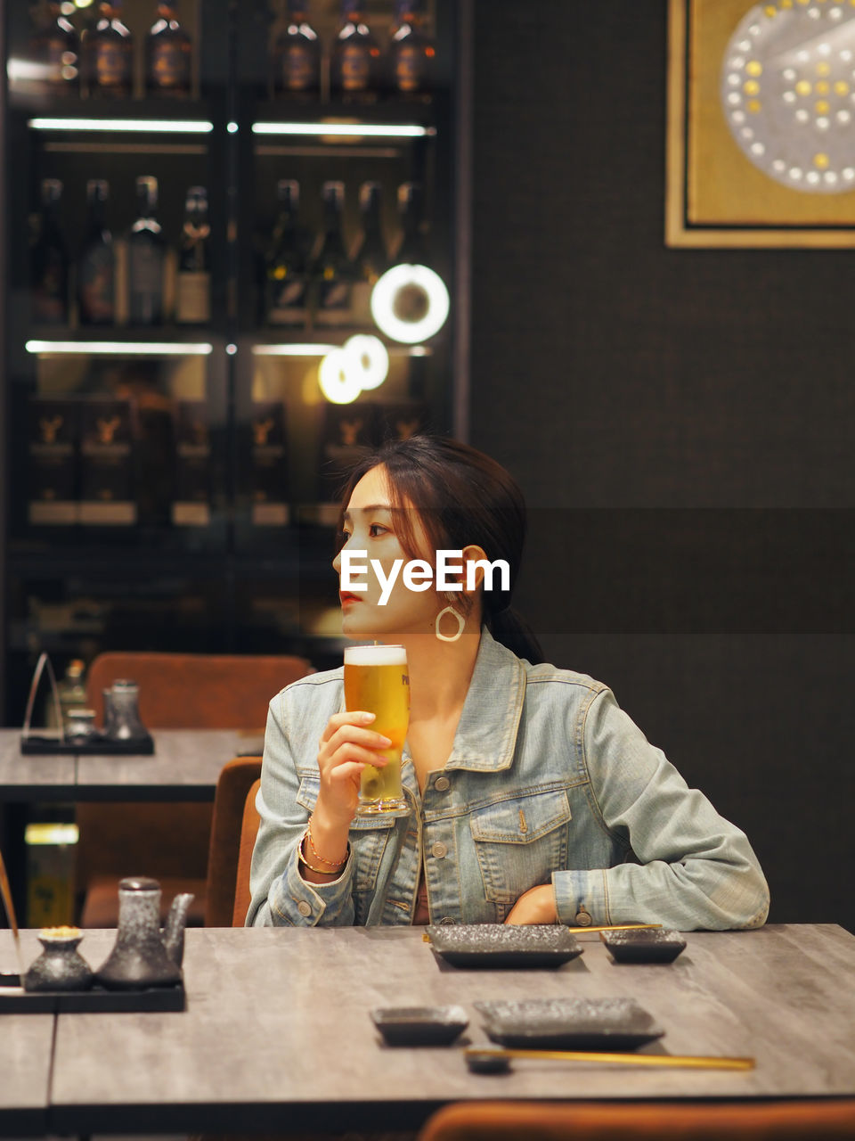 Young woman drinking glasses on table at cafe