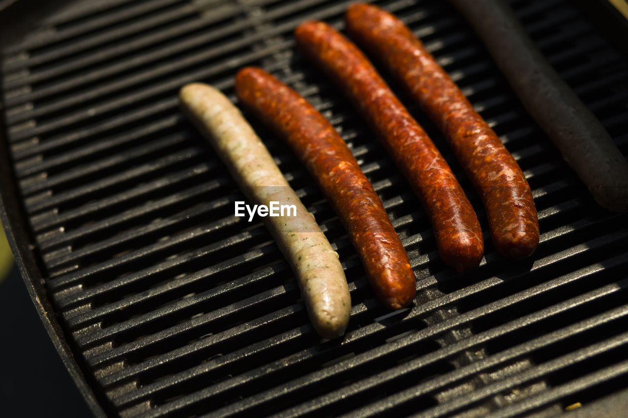 High angle view of meat on barbecue grill