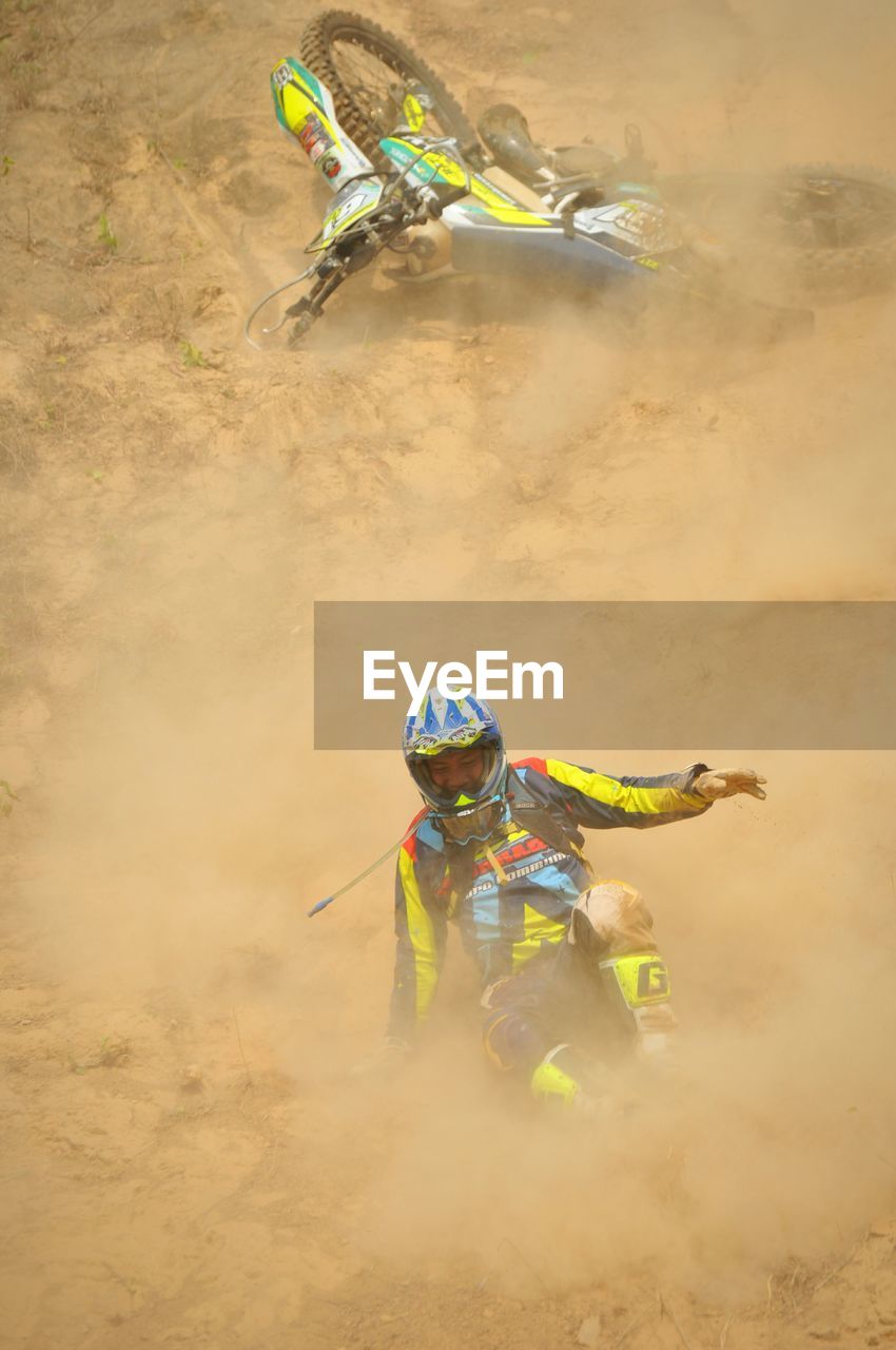 Man riding motorcycle on field