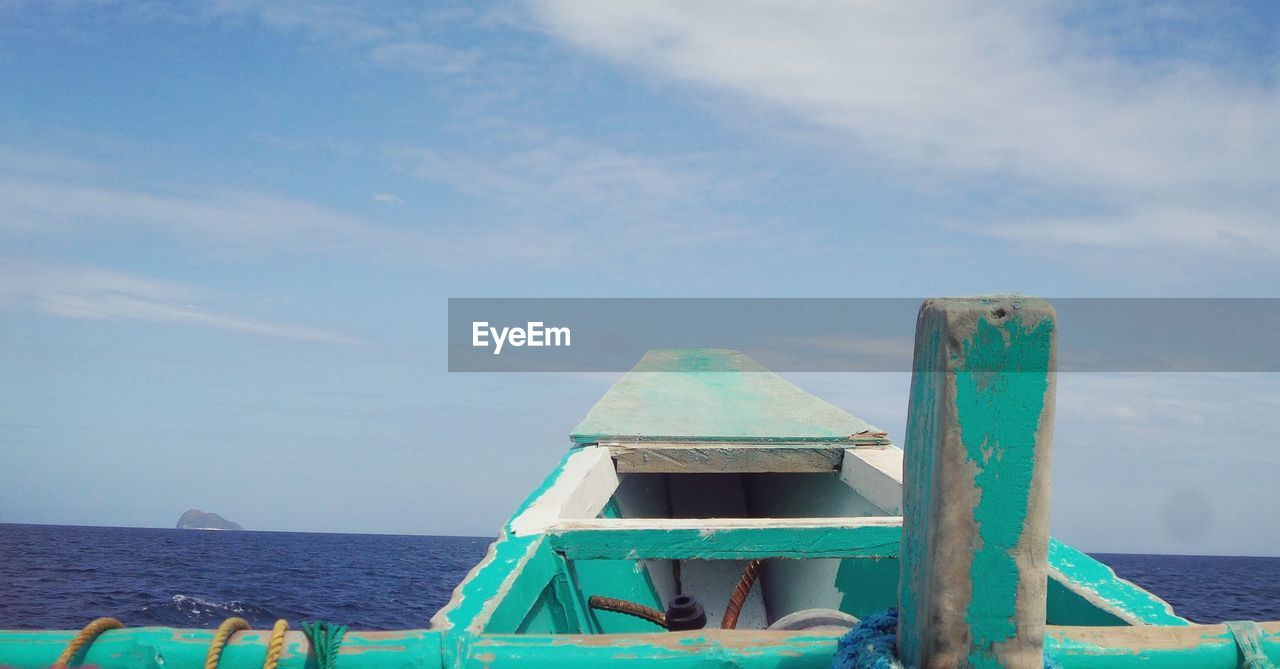 Cropped image of boat sailing in sea