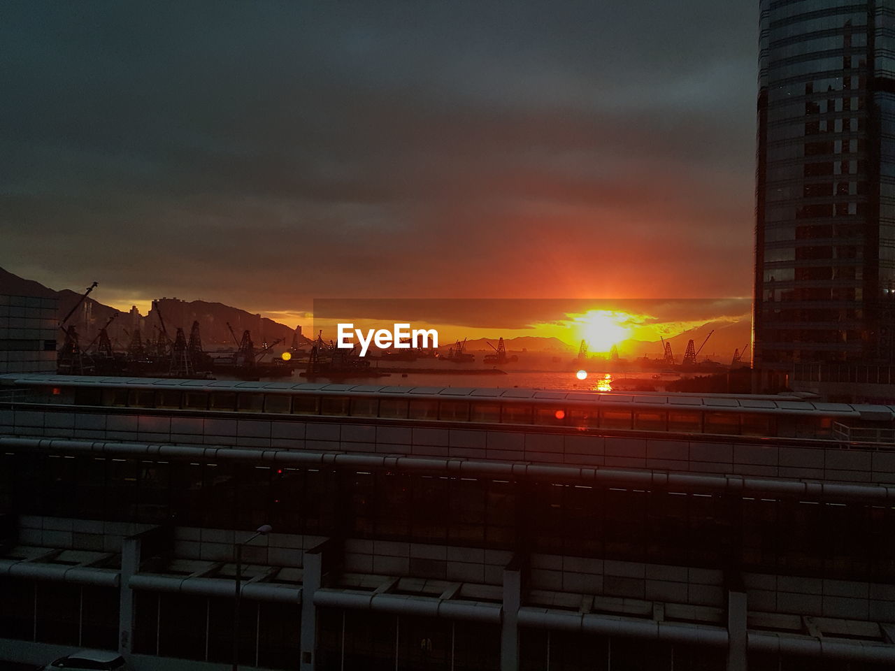 View of city against sky during sunset