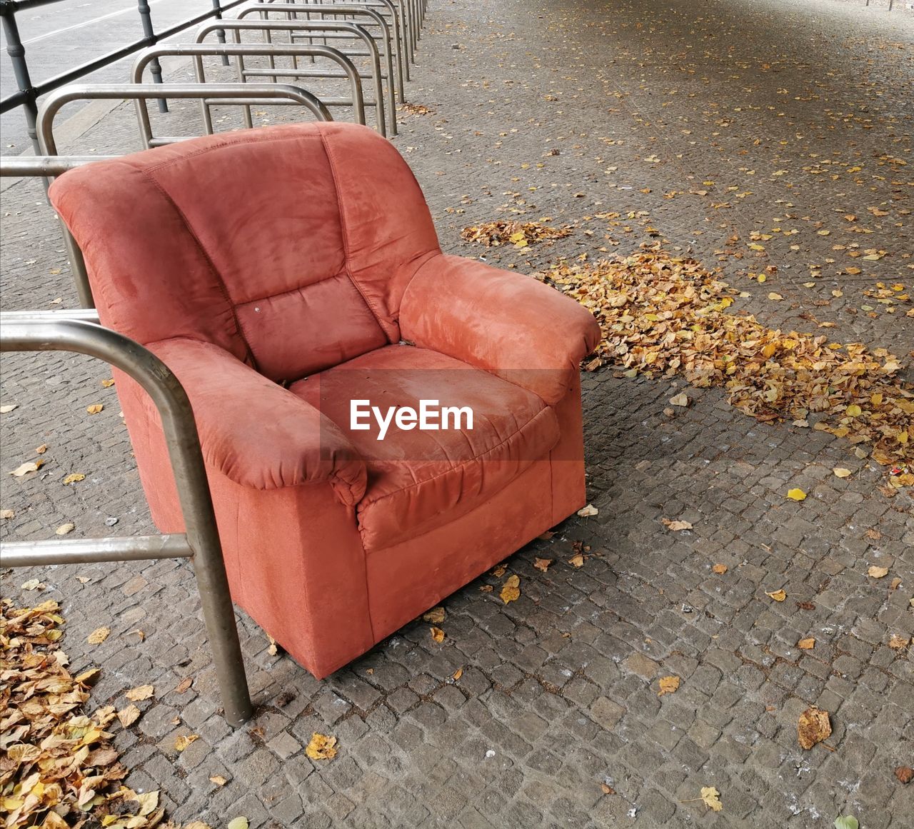 HIGH ANGLE VIEW OF ABANDONED CHAIR ON FOOTPATH