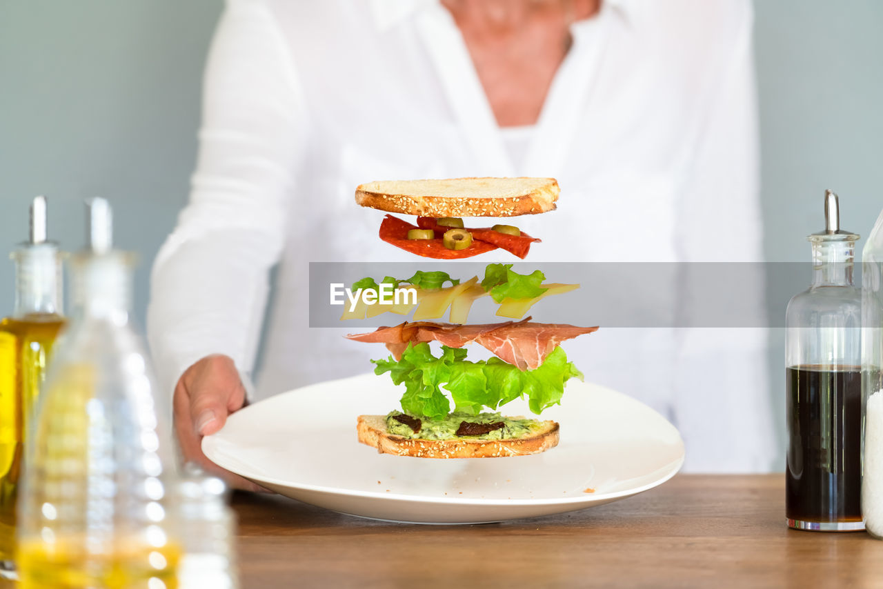 Midsection of woman holding plate