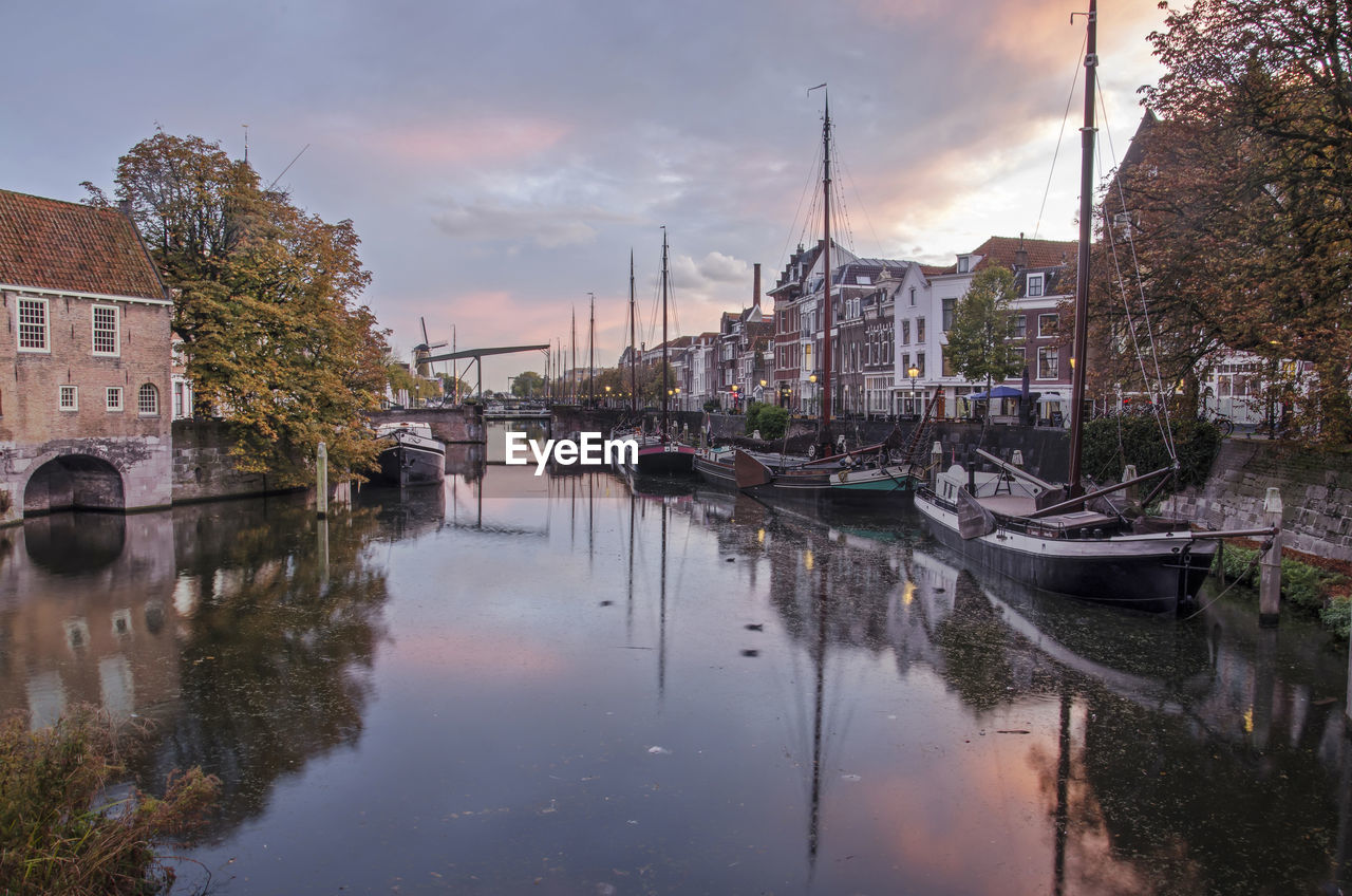 Aelbrechtskolk canal in delfshaven neighbourhood under a colorful sky at dusk