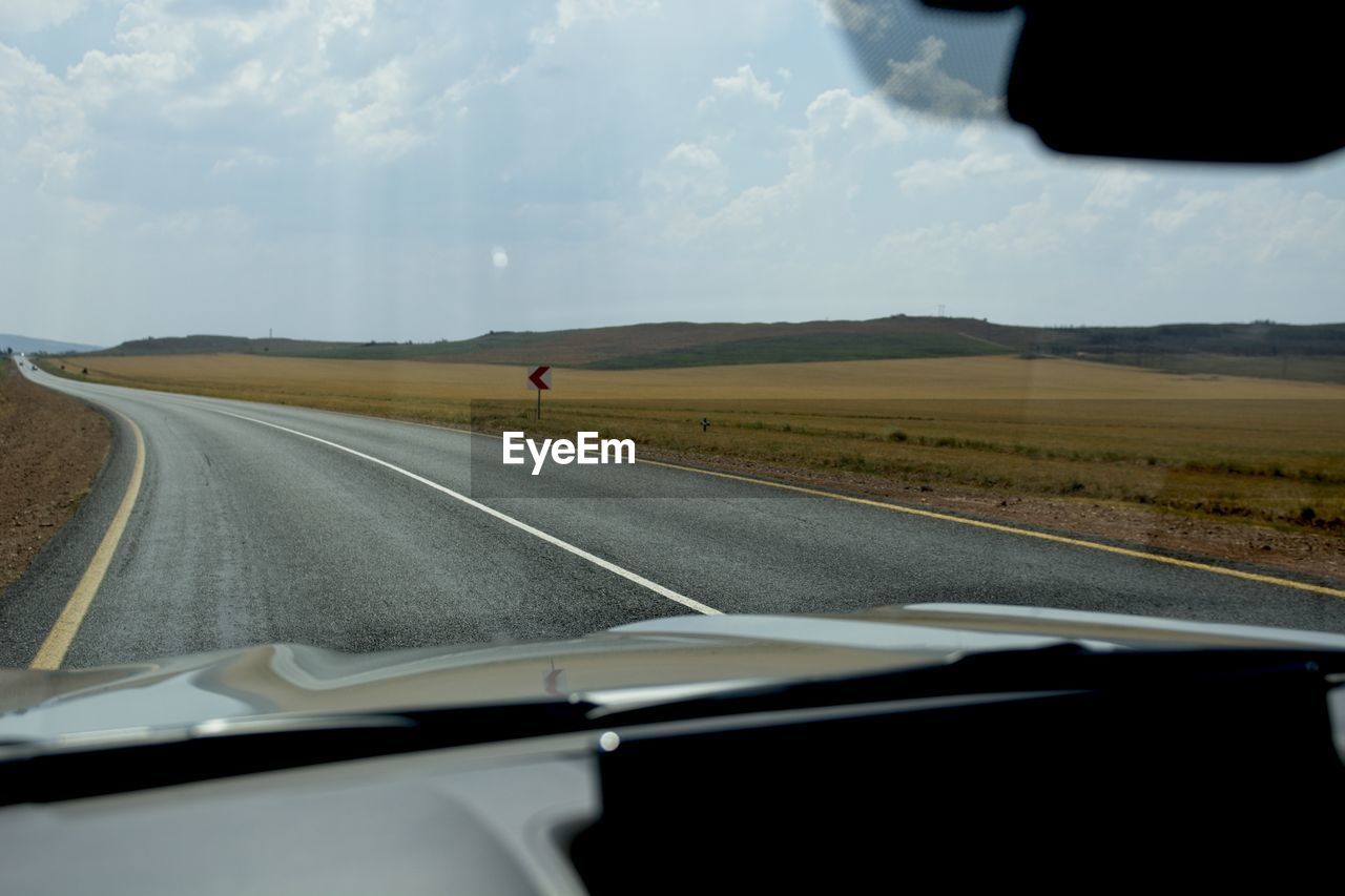 Road seen through car windshield