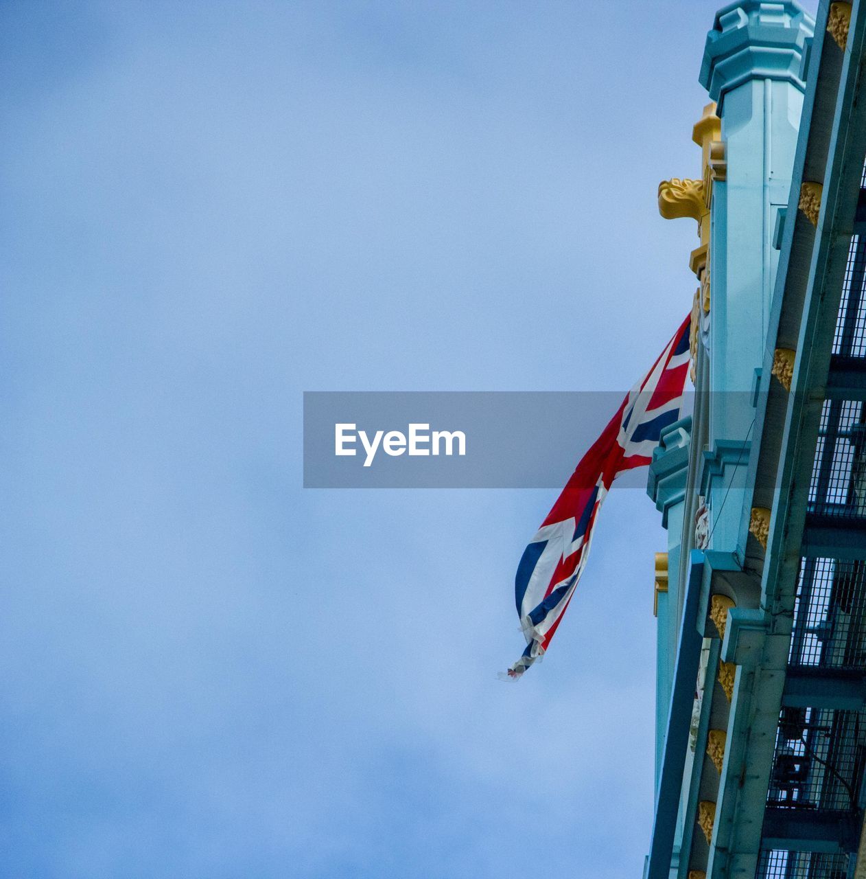 LOW ANGLE VIEW OF FLAG AGAINST CLEAR SKY