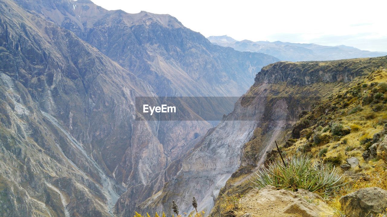 SCENIC VIEW OF MOUNTAINS AND SKY OVER MOUNTAIN