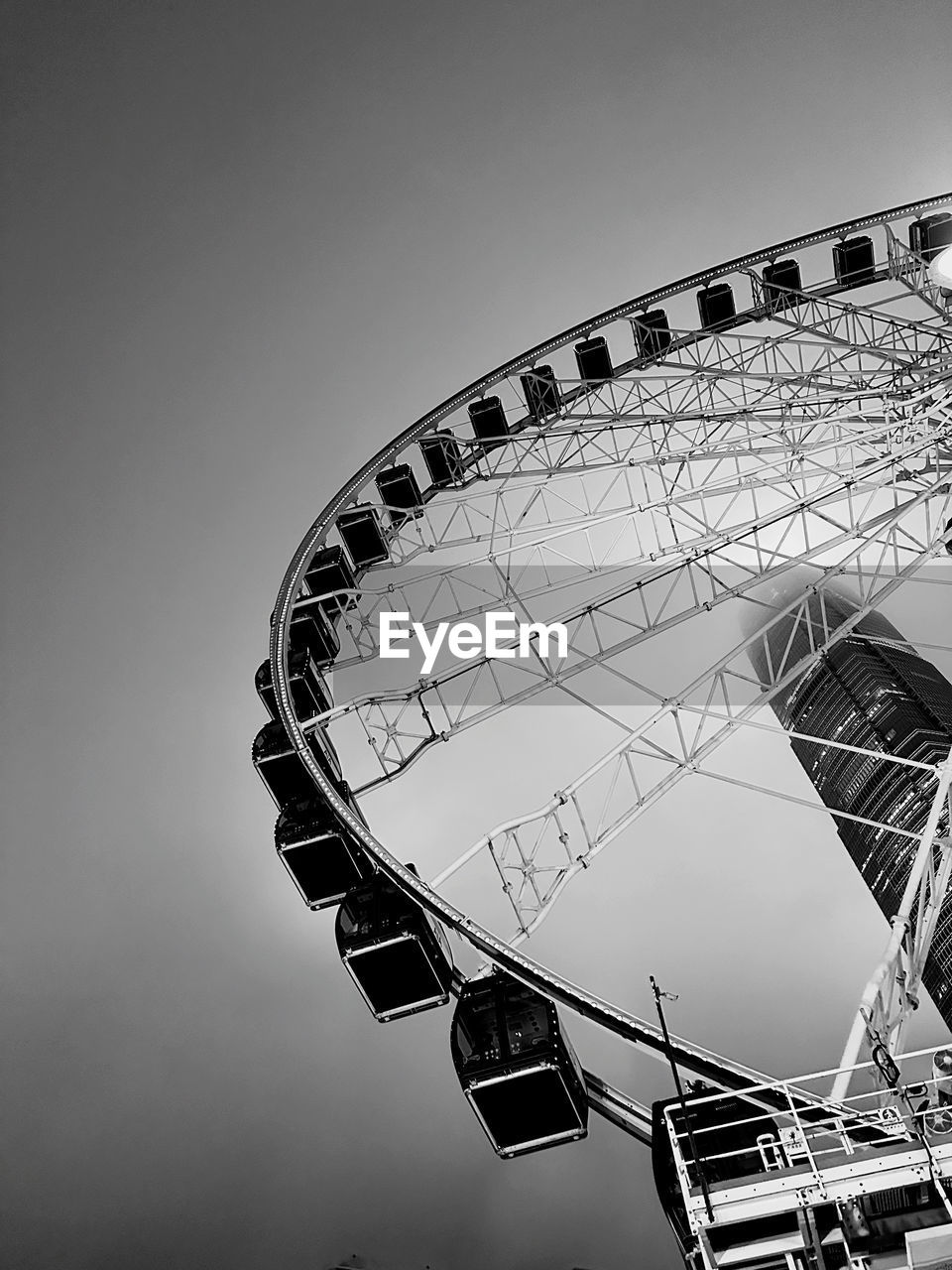 amusement park ride, black and white, amusement park, ferris wheel, monochrome, monochrome photography, arts culture and entertainment, white, sky, black, low angle view, nature, architecture, no people, built structure, outdoors, wheel, travel destinations, clear sky, carnival