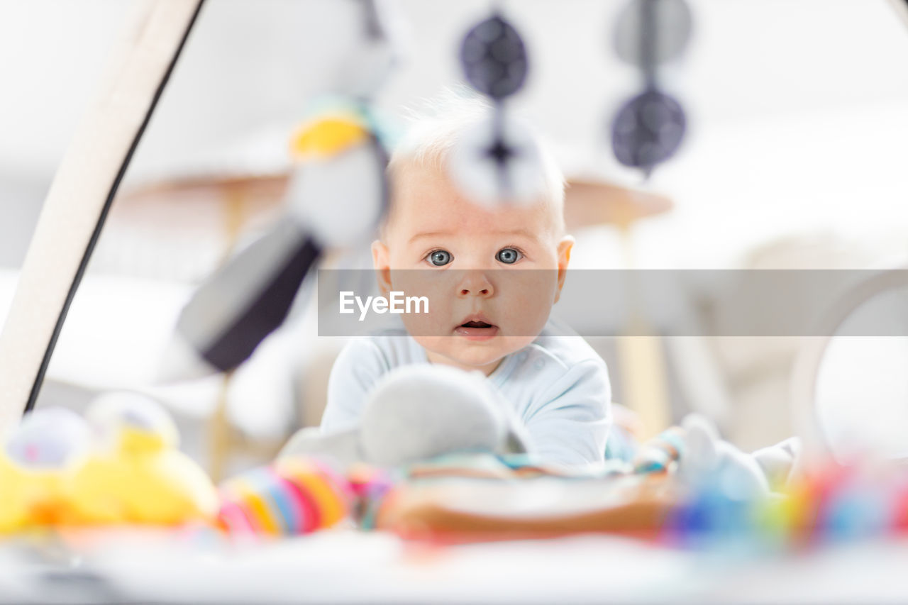 portrait of boy playing with toys on table