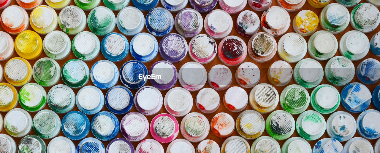 Full frame shot of abandoned spray bottle caps