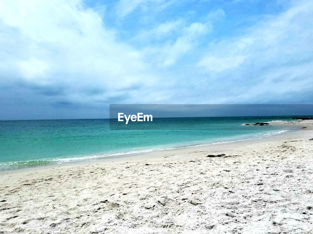 VIEW OF BEACH AGAINST SKY