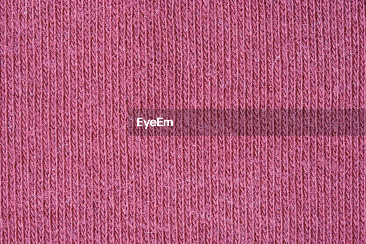 Full frame shot of pink woolen cloth