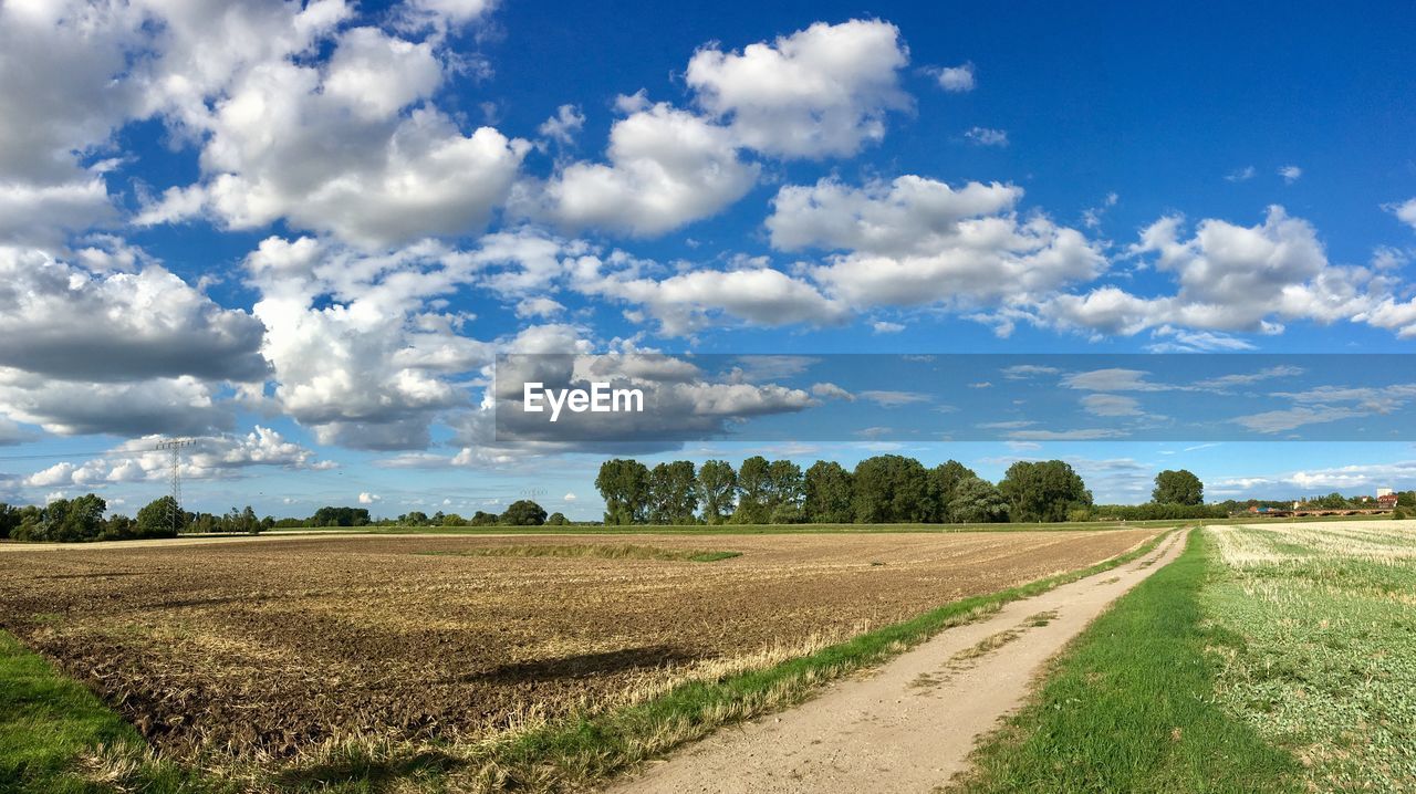 VIEW OF FIELD AGAINST SKY