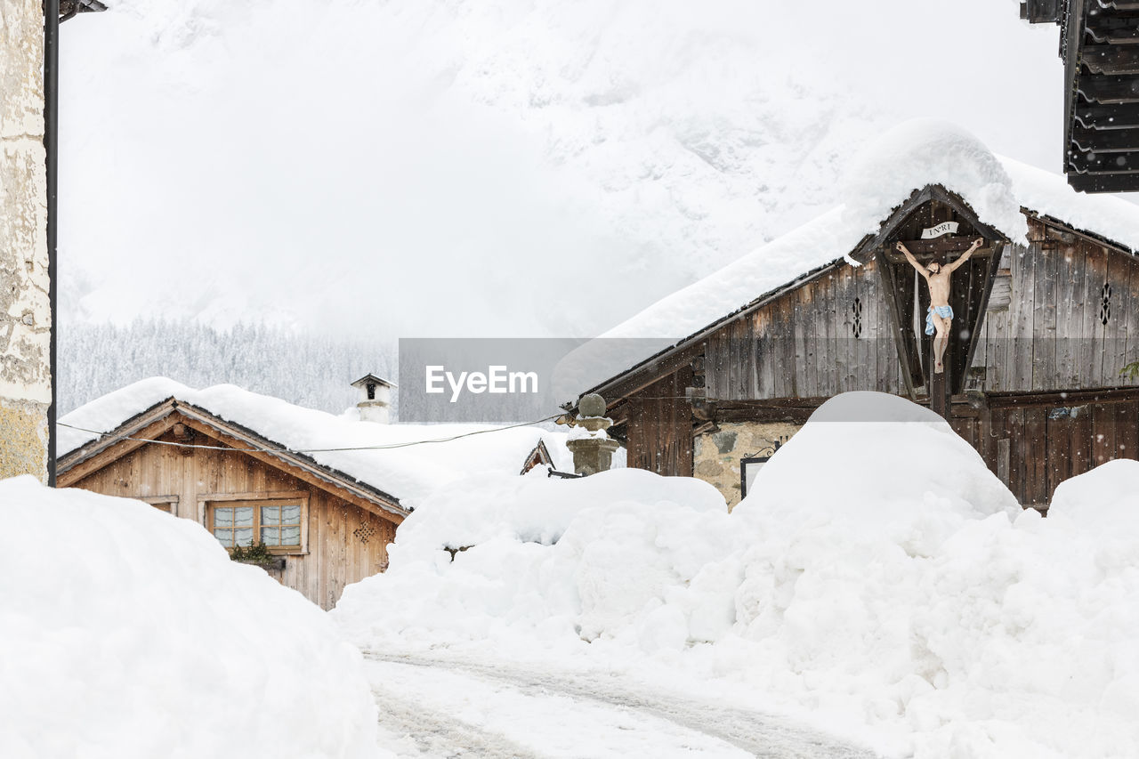 Snow magic. walk in the ancient village of sappada. friuli