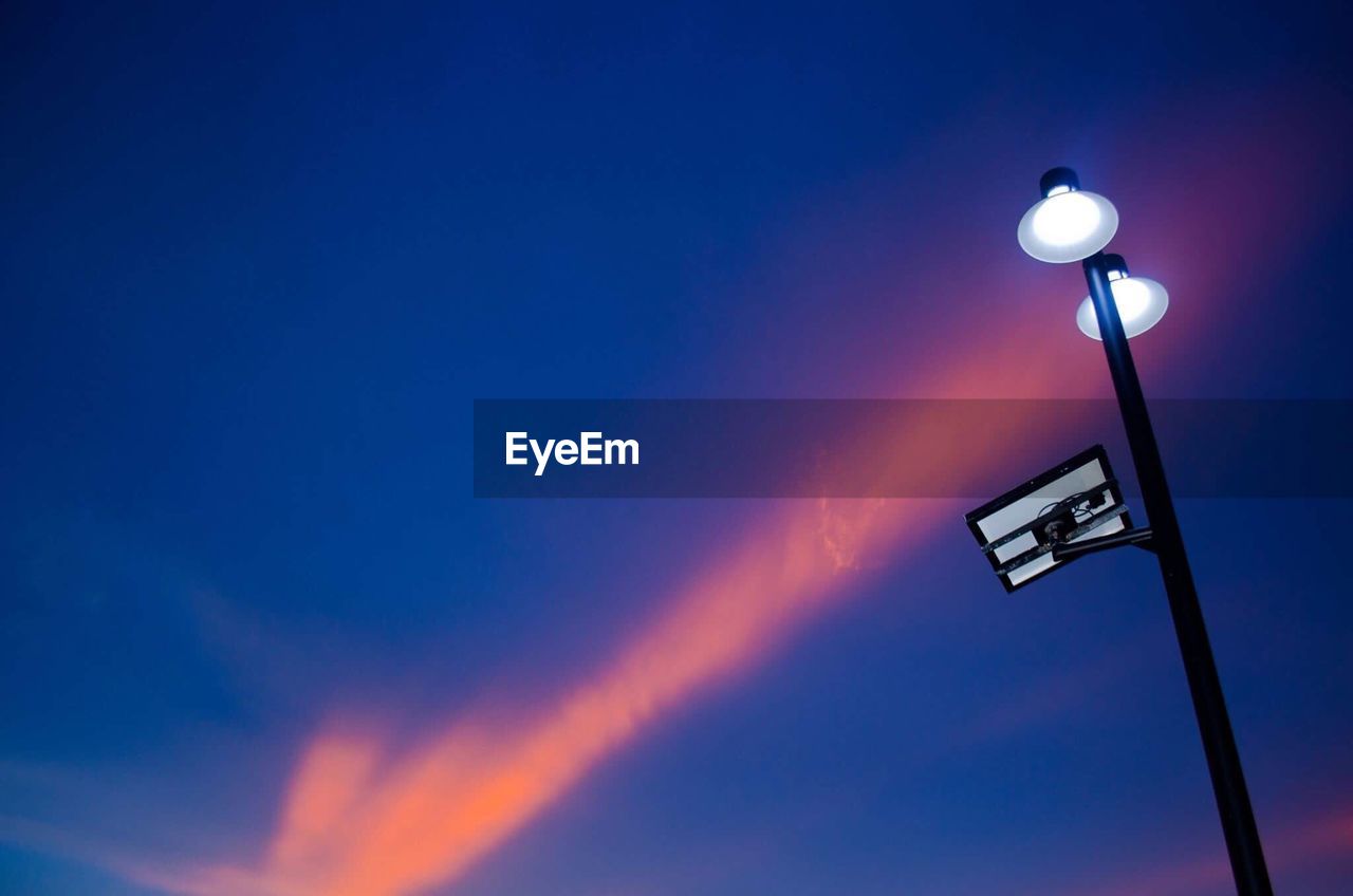 LOW ANGLE VIEW OF STREET LIGHT AGAINST BLUE SKY