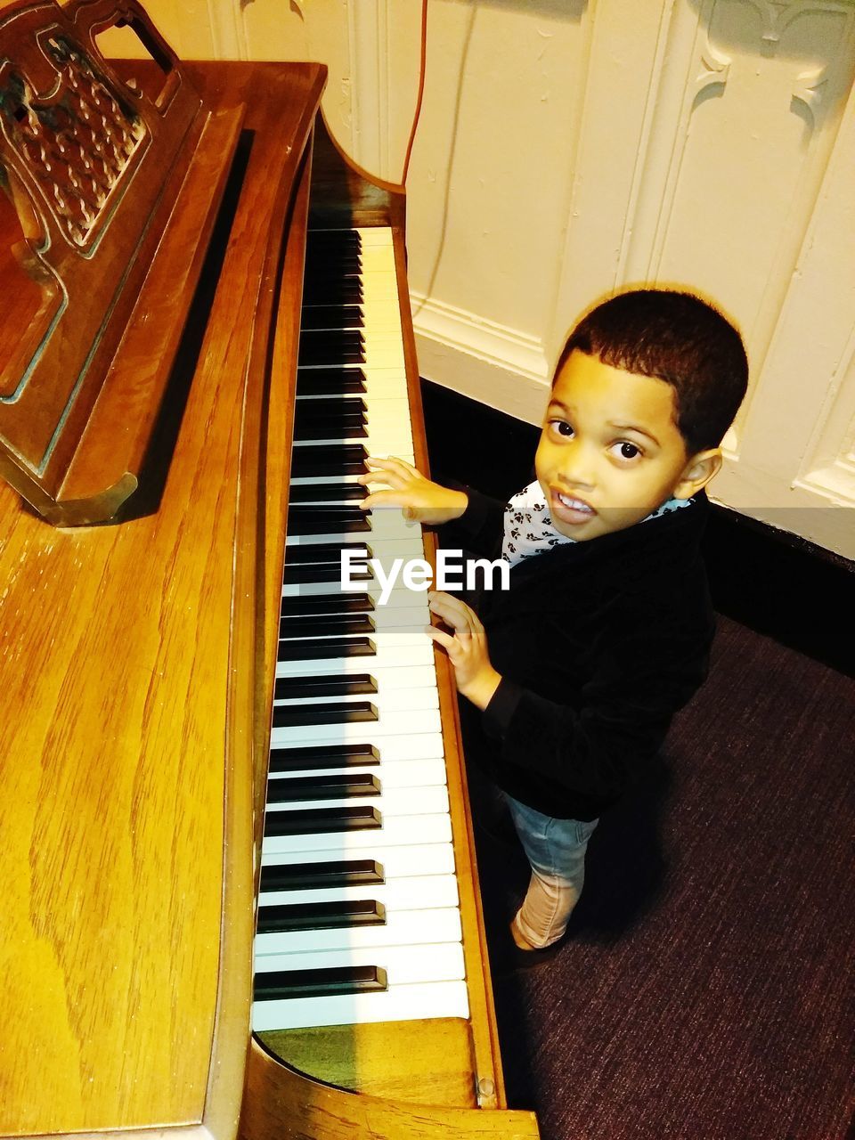 BOY PLAYING PIANO