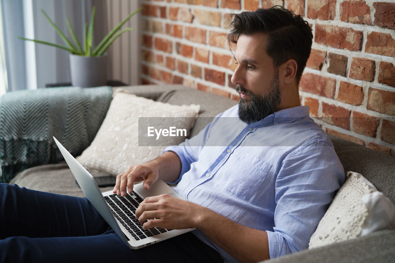 Man using laptop at office