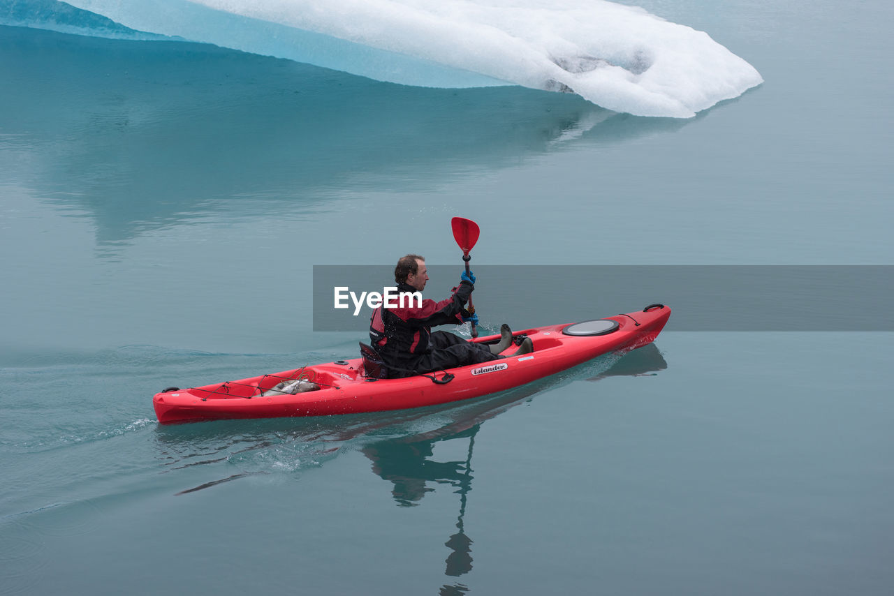 PEOPLE ON BOAT AT SEA