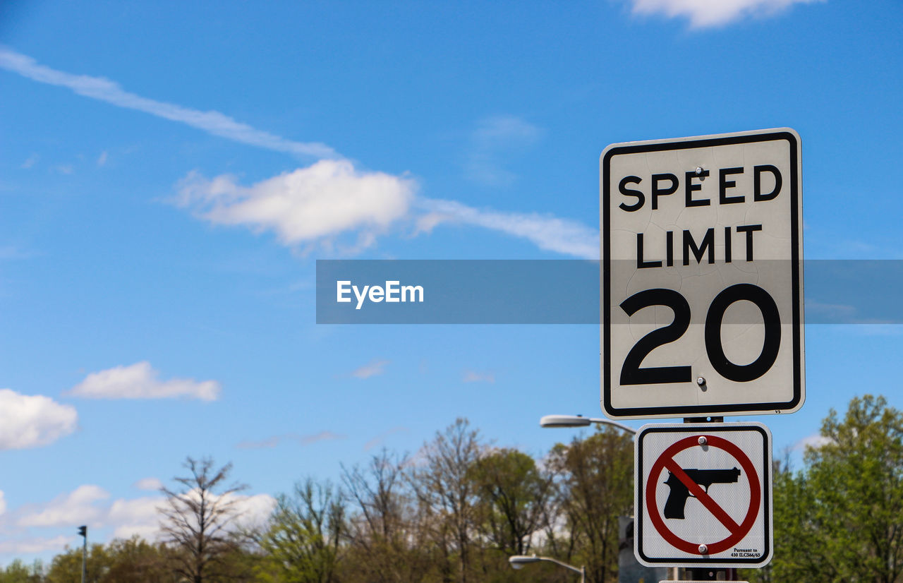 Information sign against blue sky