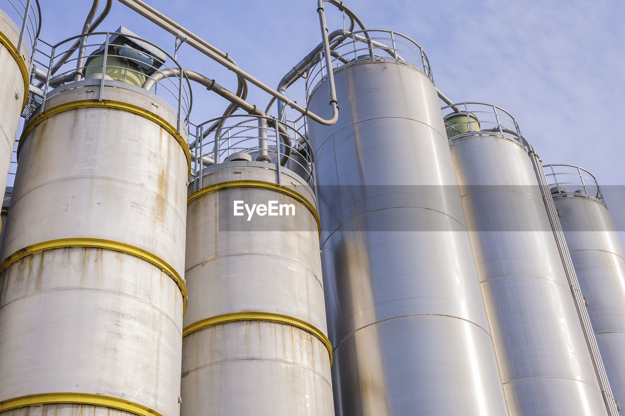 Low angle view of storage tanks