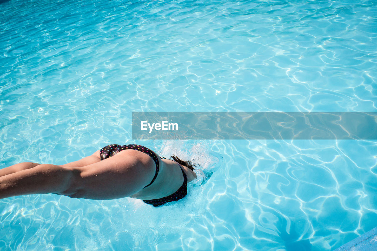 High angle view of woman diving in pool