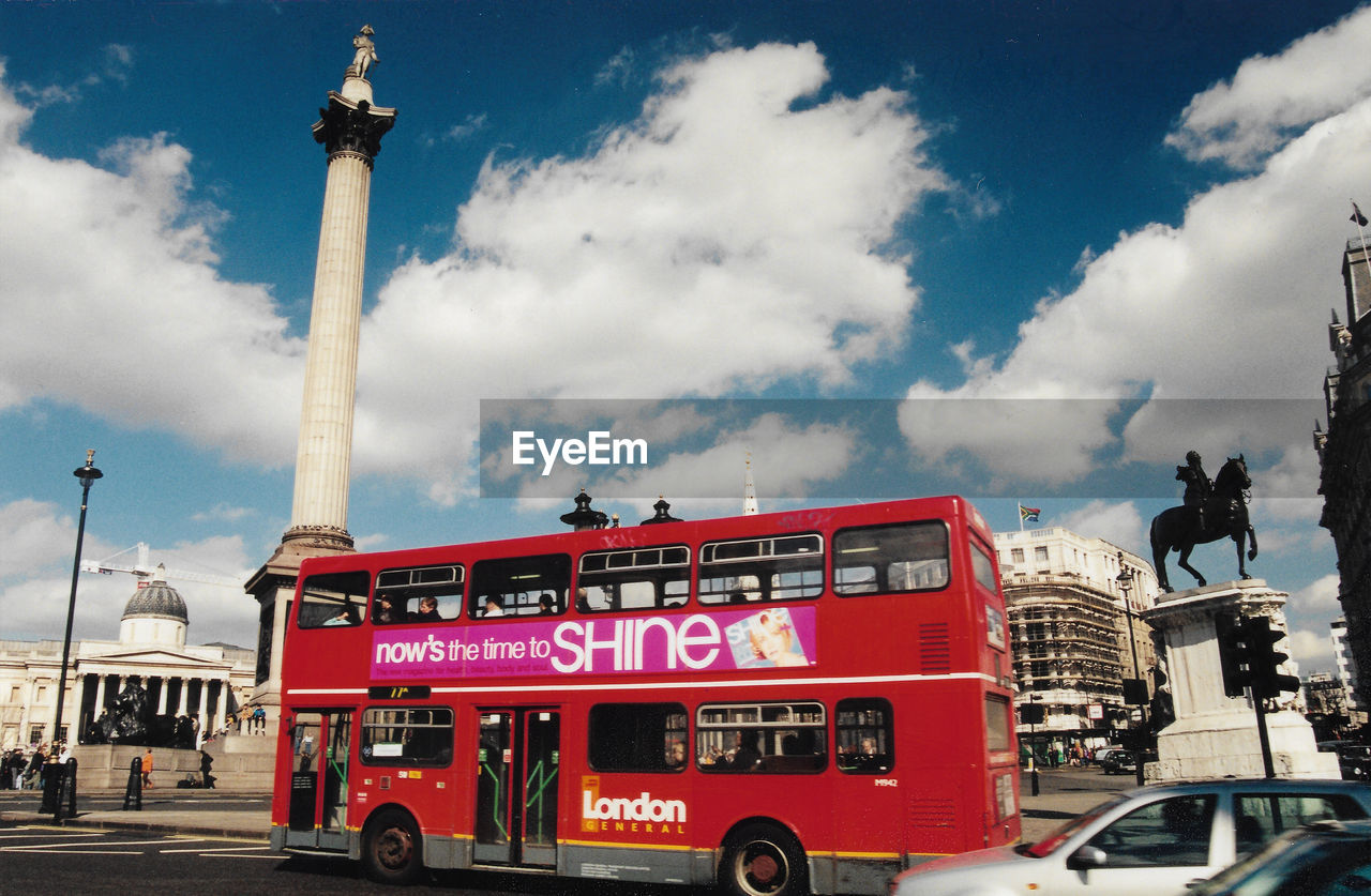 INFORMATION SIGN IN CITY AGAINST SKY IN BACKGROUND