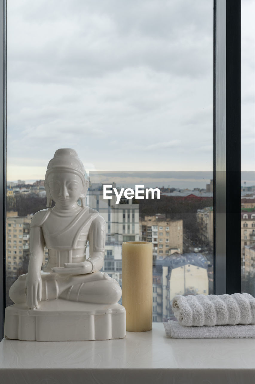 architecture, statue, sculpture, sky, cloud, window, no people, day, built structure, building exterior, art, nature, human representation, monument, white, city, outdoors, building, craft, representation, cityscape, interior design