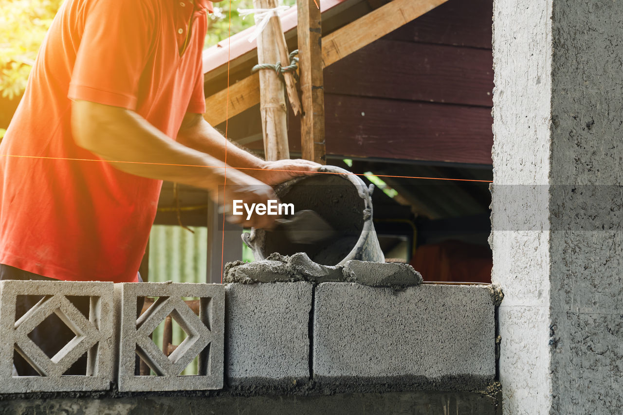 Motion blur bricklayer man working build for construction at home