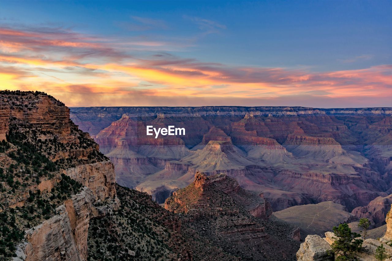 Scenic view of mountain against cloudy sky