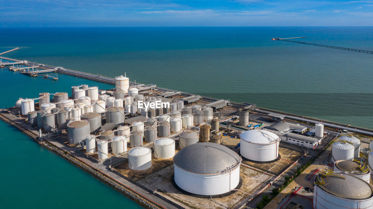 Aerial view of silos over sea