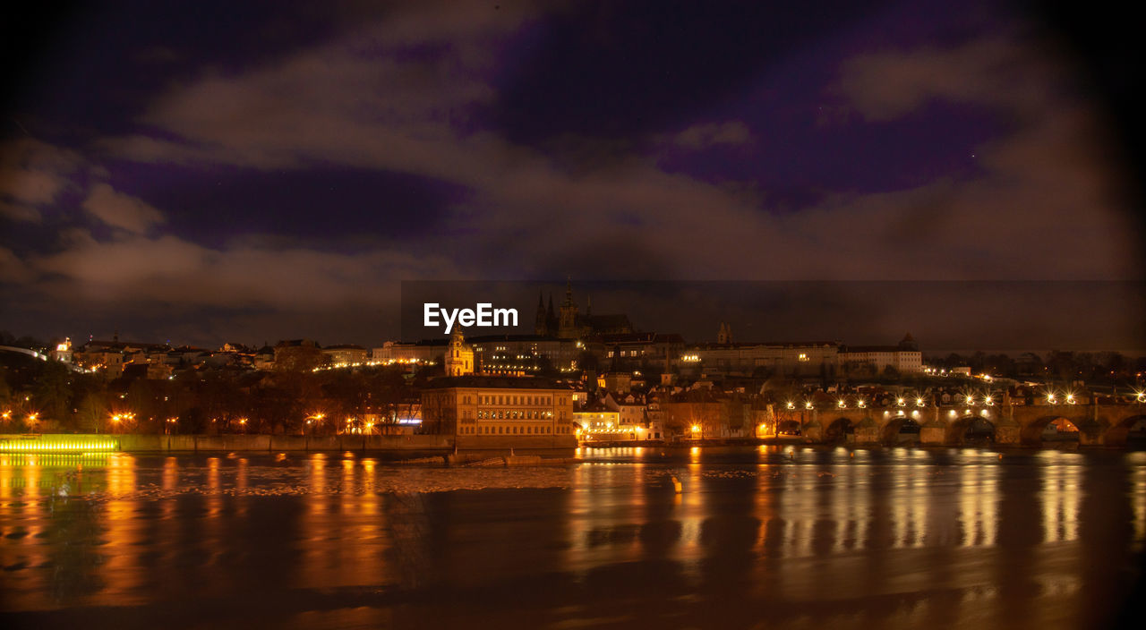 Illuminated buildings in city at night