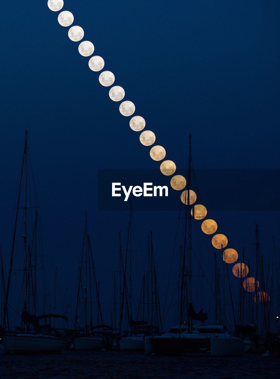 Low angle view of sailboat against sky at dusk