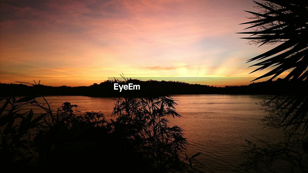 Scenic view of lake against romantic sky