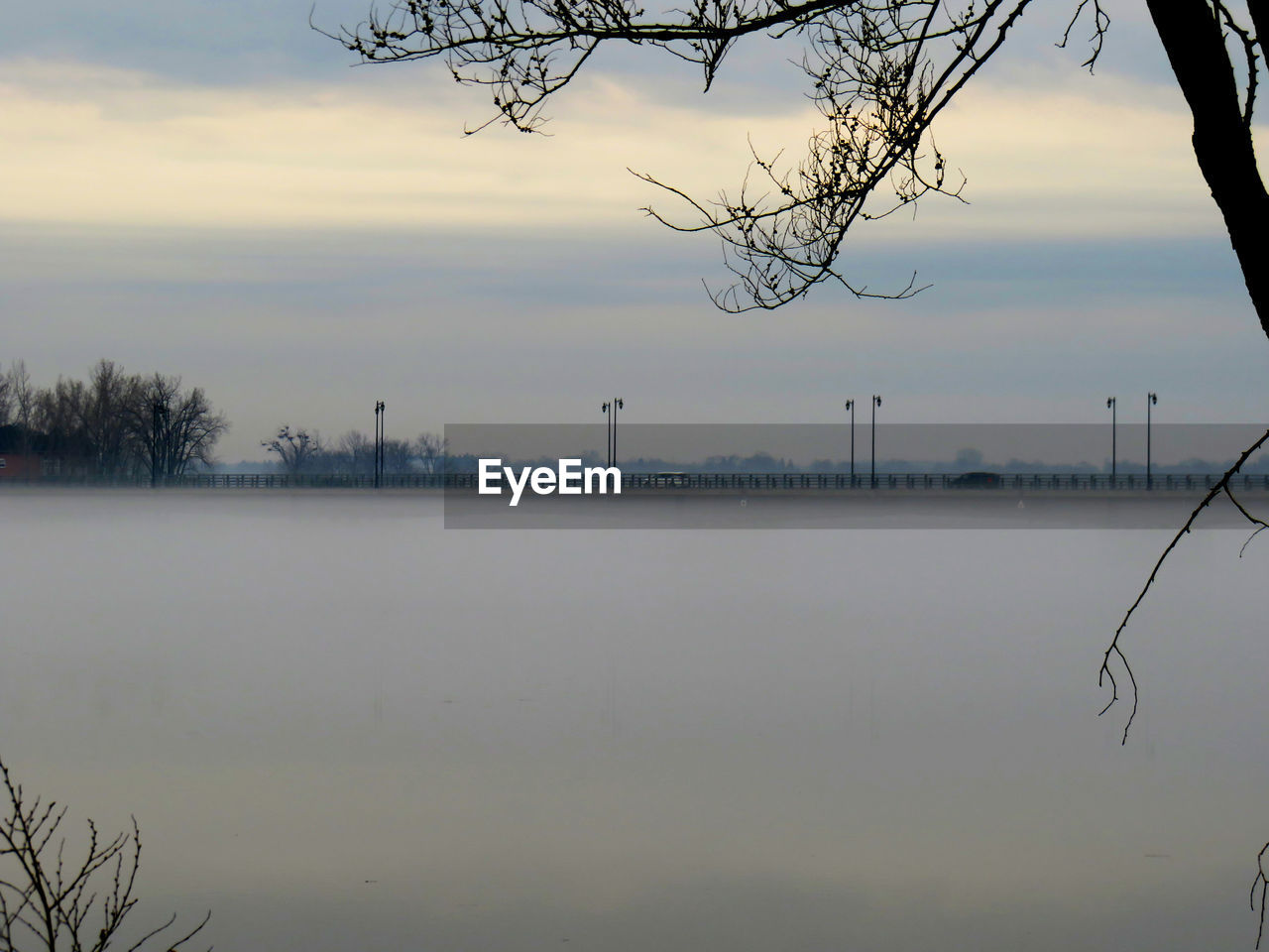 VIEW OF LAKE AGAINST SKY DURING SUNSET