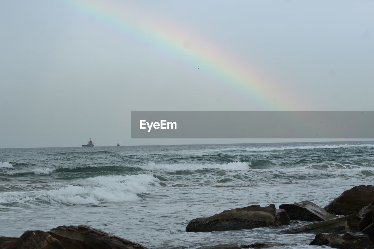 SCENIC VIEW OF RAINBOW OVER SEA