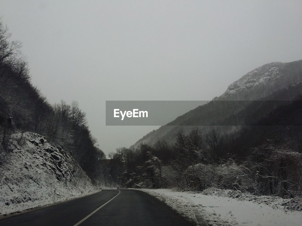 ROAD PASSING THROUGH MOUNTAINS