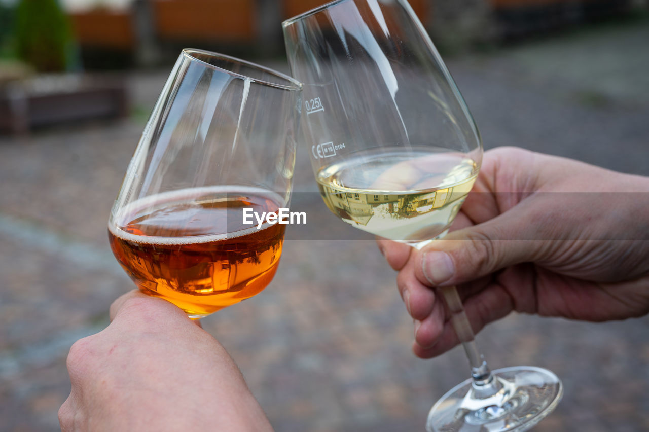 cropped hand of person holding wineglass