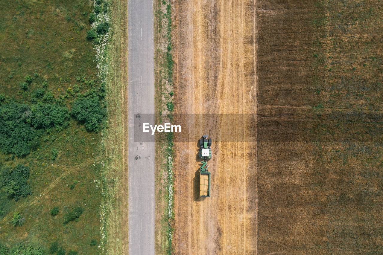 Tractor on a field. aerial top view. organic products concept. agriculture industry.