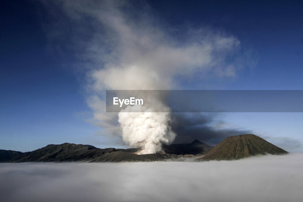 SMOKE EMITTING FROM VOLCANIC LANDSCAPE