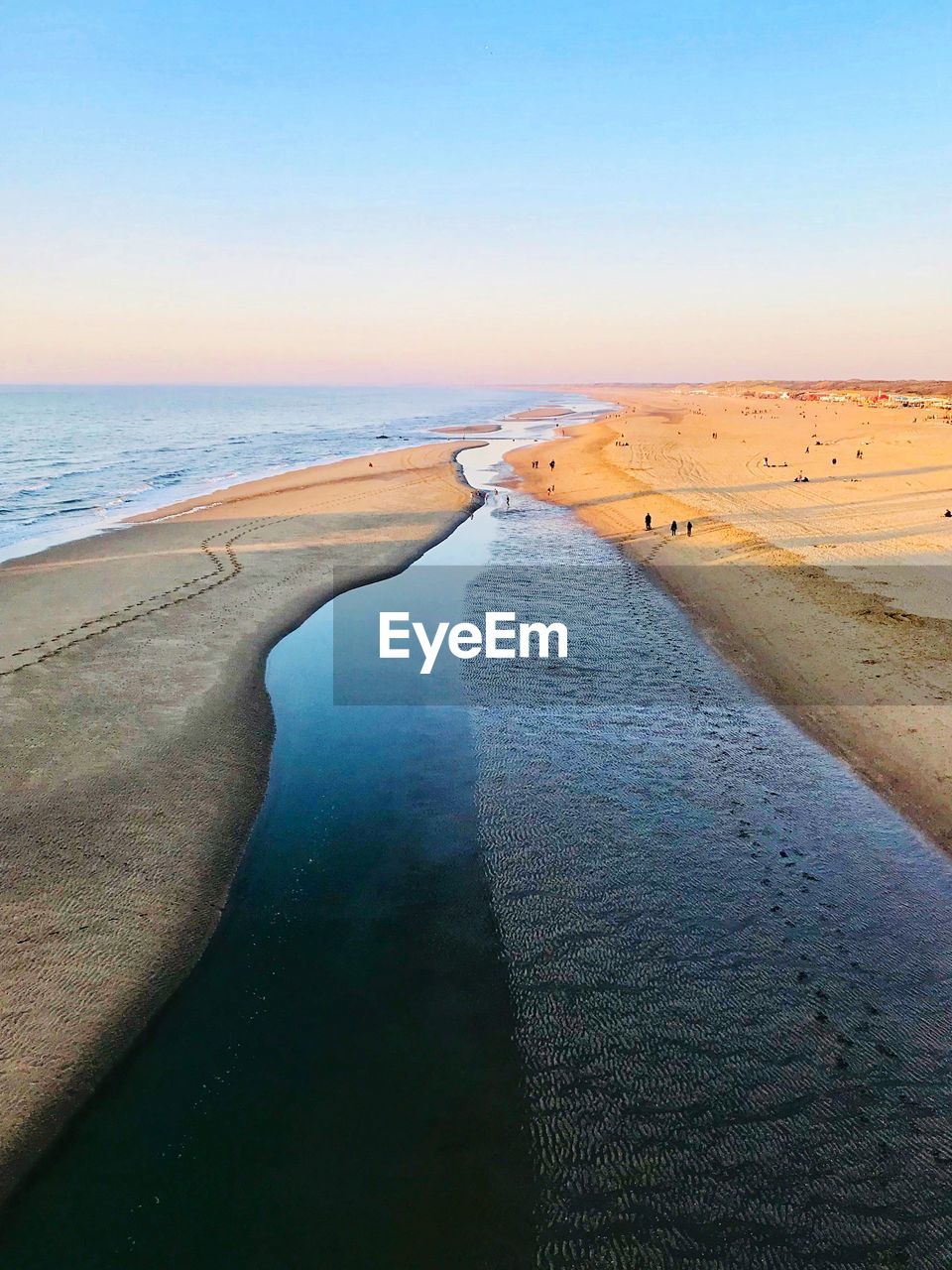 Scenic view of sea against clear sky during sunset