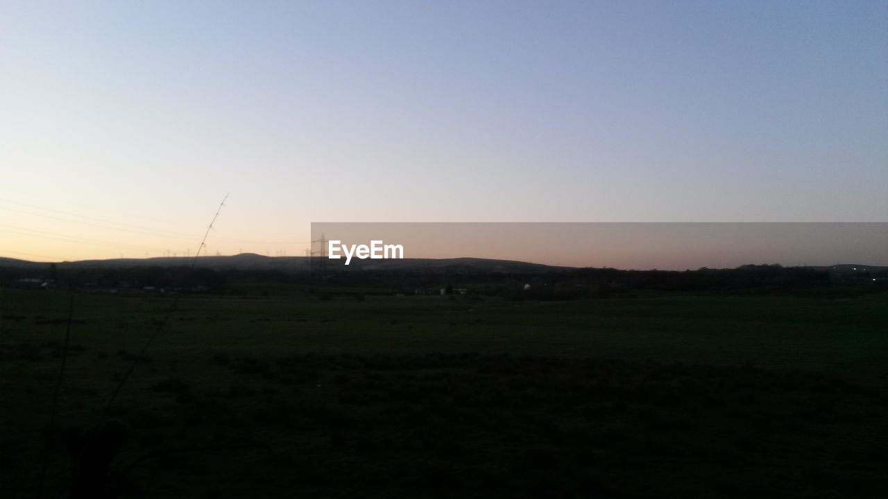 VIEW OF LANDSCAPE AT SUNSET