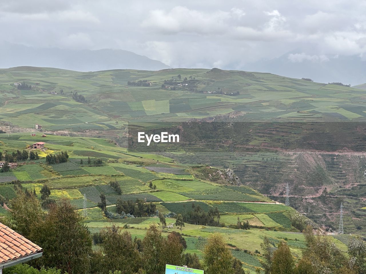 environment, landscape, land, rural scene, agriculture, scenics - nature, field, nature, plant, hill, building, architecture, rural area, sky, highland, house, cloud, village, beauty in nature, farm, crop, social issues, tree, growth, environmental conservation, no people, tranquility, residential district, food and drink, green, outdoors, built structure, aerial photography, travel, building exterior, valley, mountain range, food, high angle view, fog, tranquil scene, tourism, day, overcast, plateau, travel destinations, city