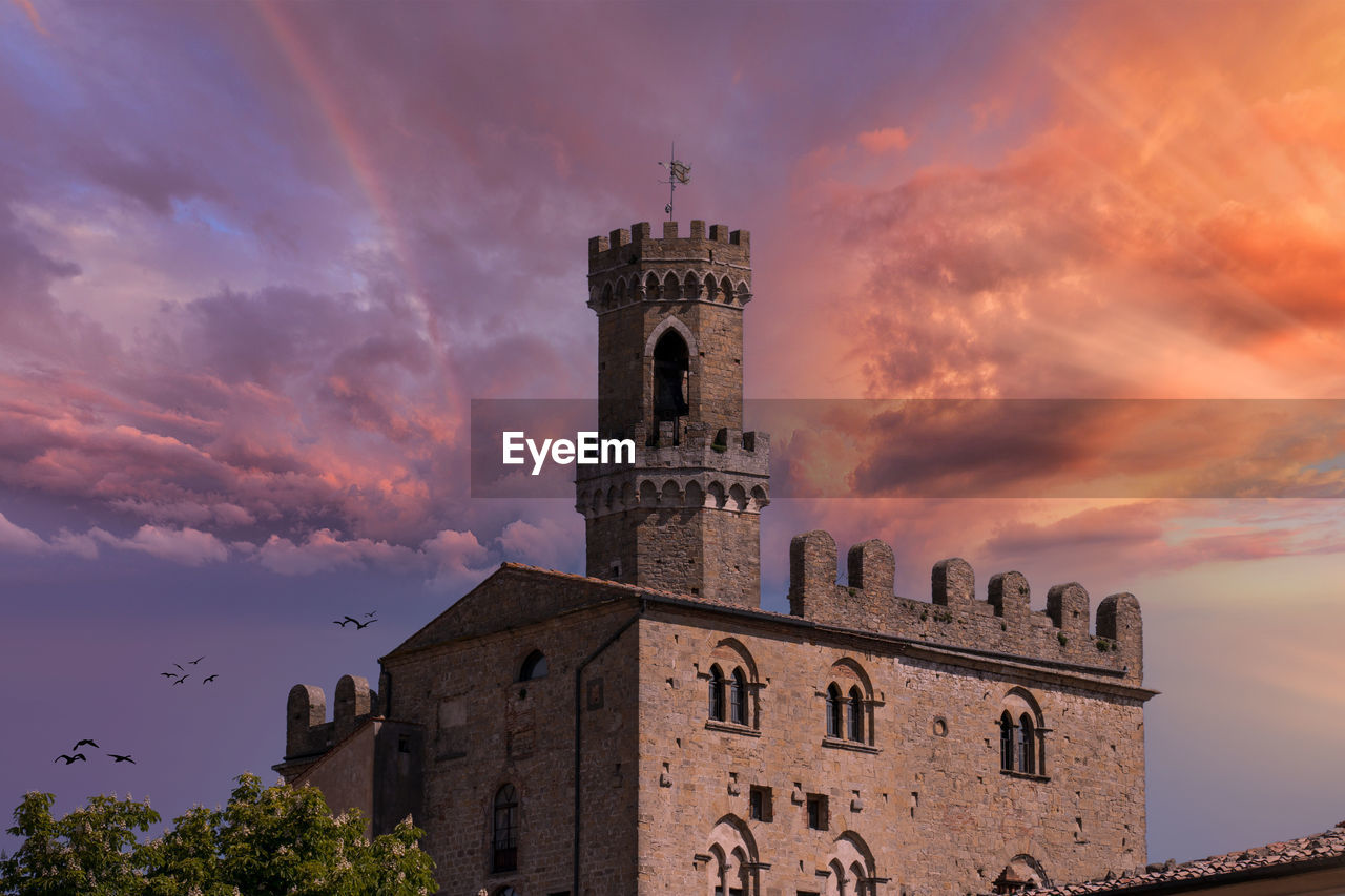 low angle view of historic building against sky during sunset