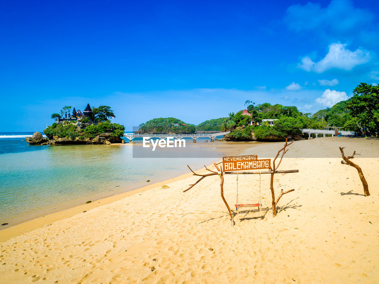 Scenic view of beach against blue sky
