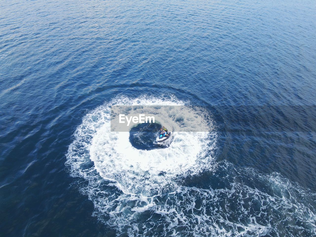 HIGH ANGLE VIEW OF PERSON ON SEA SHORE