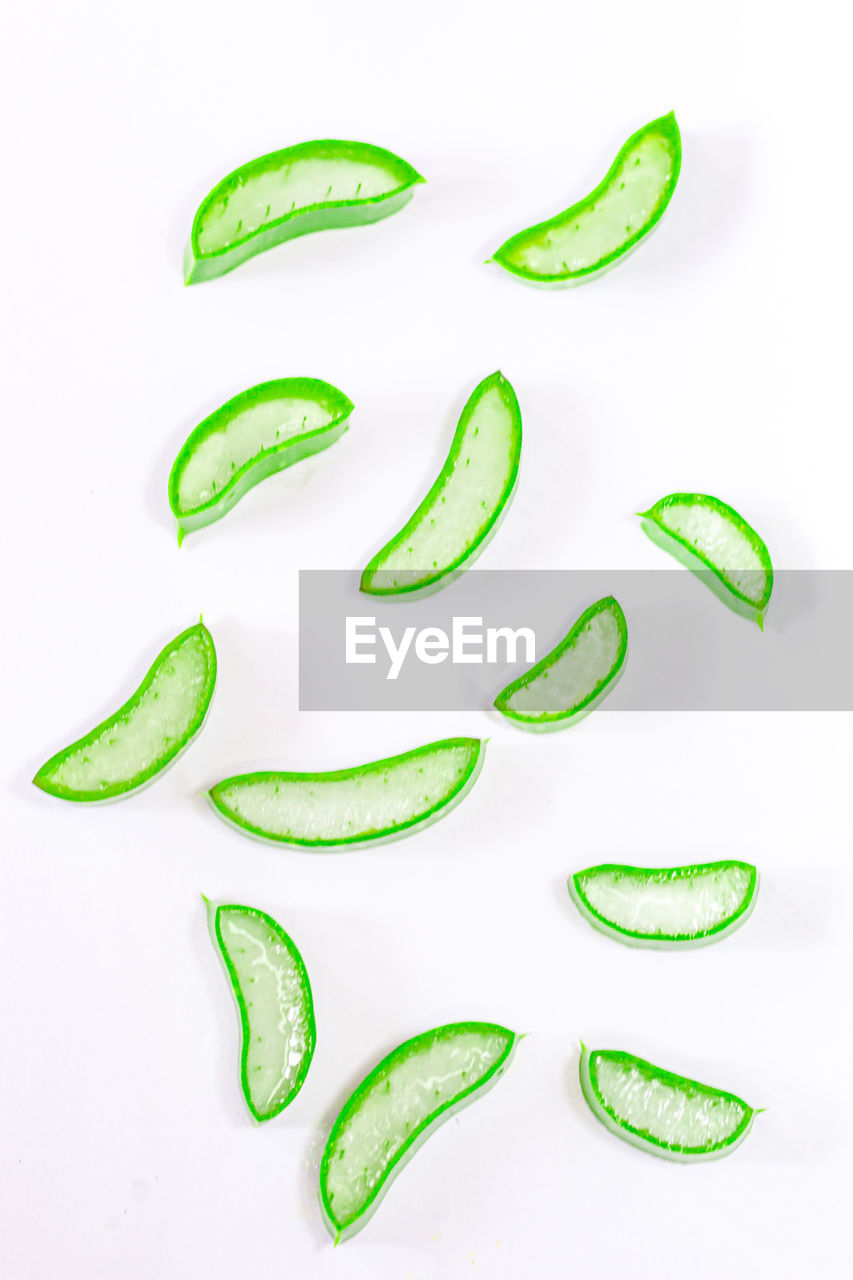 food, food and drink, green, vegetable, healthy eating, white background, studio shot, wellbeing, produce, freshness, indoors, no people, cucumber, leaf, plant, font, cut out, slice